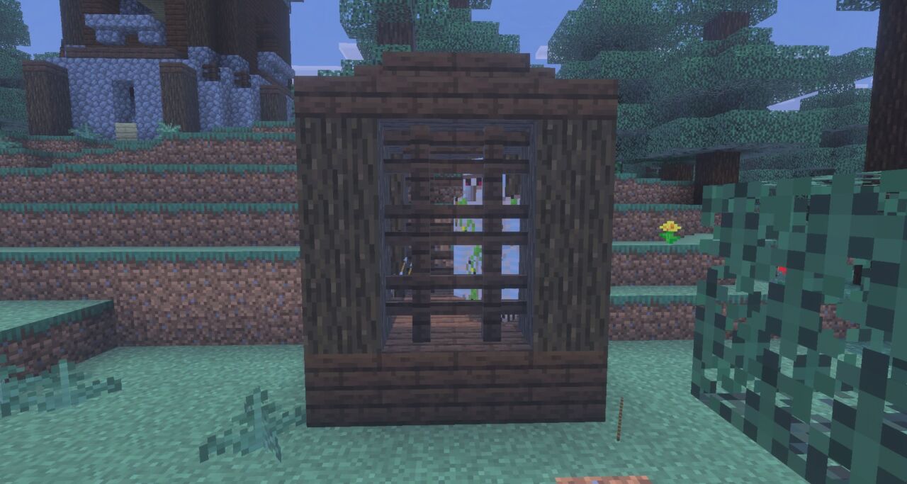 マイクラの前哨基地の周辺にある檻にアレイが閉じ込められている画面